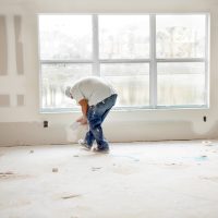 Construction: Man installing plasterboard