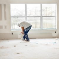 Construction: Man installing plasterboard